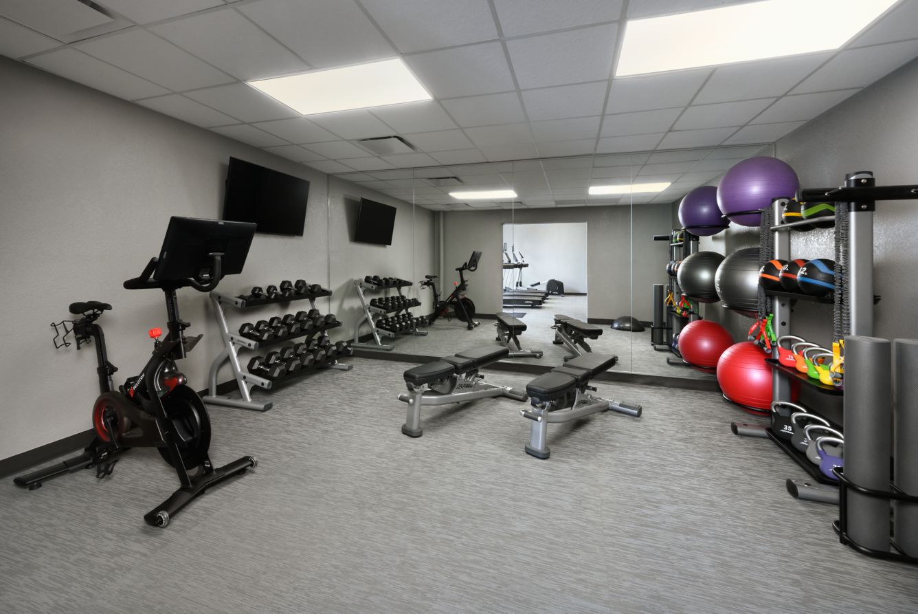 Fitness center with free weights, bike, and strength equipment