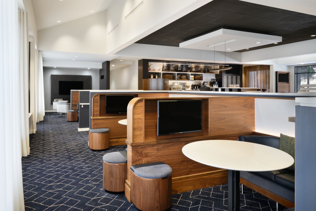 Lobby media pods with private TV booths for working travelers