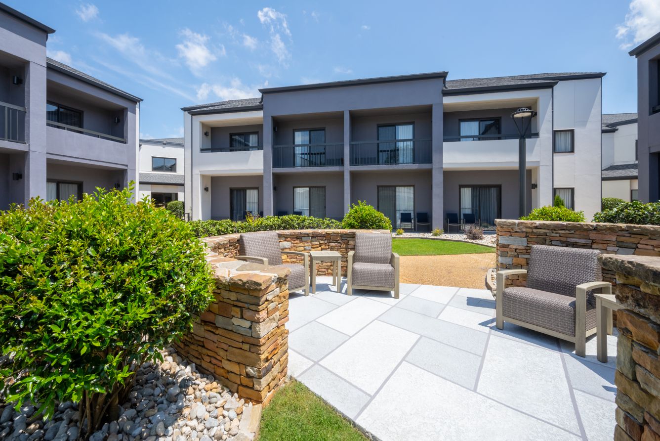 Outdoor courtyard patio with stone seating area